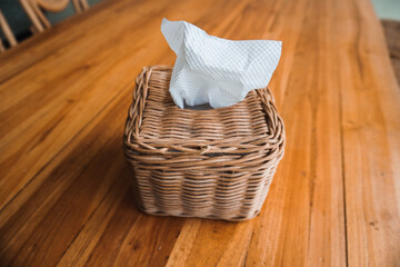 A handmade tissue box made from woven bamboo