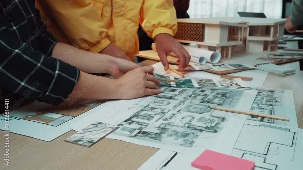 Poster a dynamic teamwork scene showcasing professionals engaged in a brainstorming session with architectu