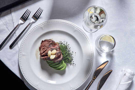 Ribeye steak with avocado.