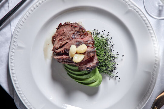 Ribeye steak with avocado.
