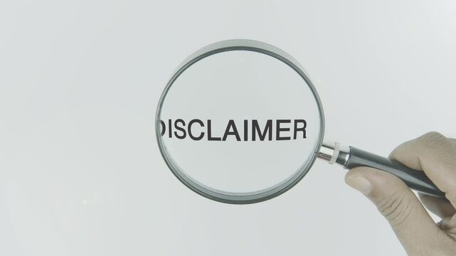 Disclaimer word or text highlighted by a magnifying glass in a hand on a white background, symbolizing legal notice, caution, and clarification