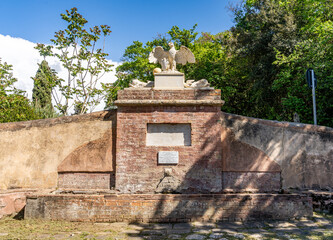 Eagle's Fountain (Italian "Fonte dell'Aquila"), built in 1825 by the Gherardesca family, with a sculpture of an eagle, in Bolgheri, municipality of Castagneto Carducci, Tuscany, Italy