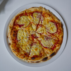 Delicious Pepperoni Pizza on a White Plate