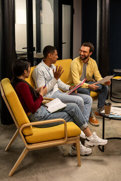 Business meeting of three people in office