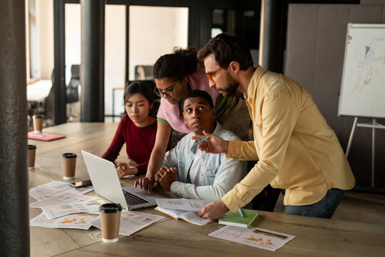 Office manager explains task to group of workers