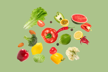 Collection of vegetables and fruits levitation green background.