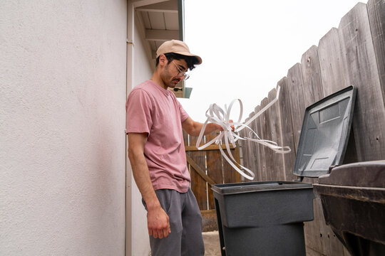 Throwing trash in bin