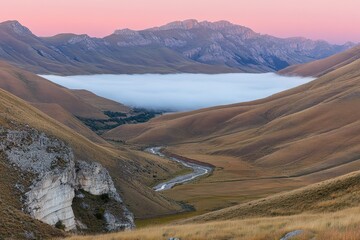 Serene Mountain Valley with Fog-Covered River at Dawn