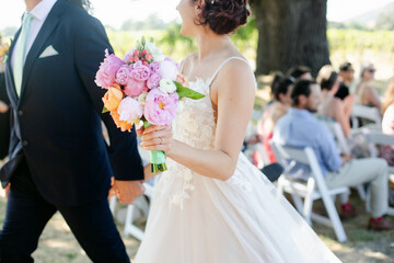 Closeup of Bride and Groom Walking down the Aisle