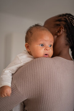 Mother holding baby for burping