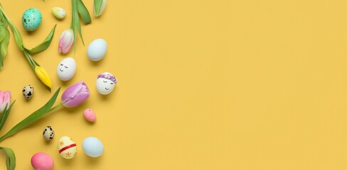 Many Easter eggs and tulips on yellow background with space for text, top view