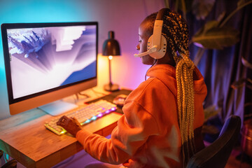 Candid woman playing video game