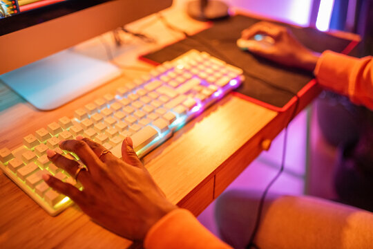 Anonymous woman using computer keyboard and mouse