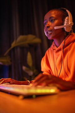 Woman playing online multiplayer video game