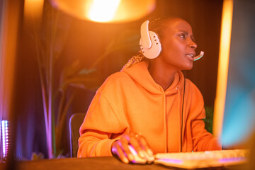 Determined woman playing video game