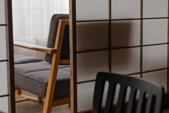 Modern chair in a minimalist hotel room with sliding shoji screens