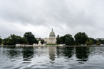 United States Capitol Building reflecting in the calm waters