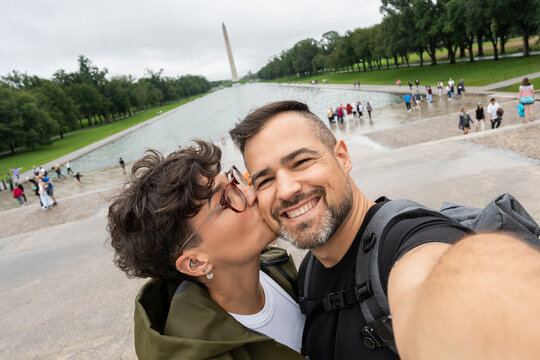 Tourists taking selfie kissing in Washington D.C.