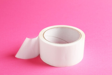 One masking tape on pink background, closeup