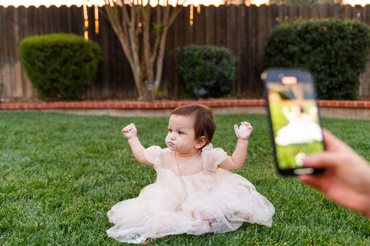 Taking cellphone picture of baby