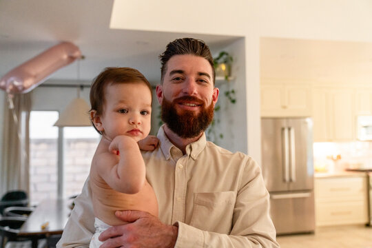 Dad carrying baby
