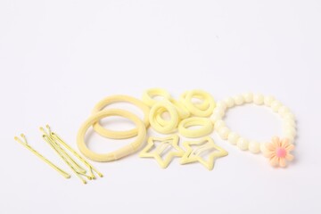 Yellow cute hair accessories on white background