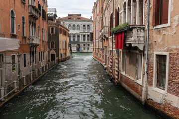 Venice canal without boats and on the sides are historical buildings