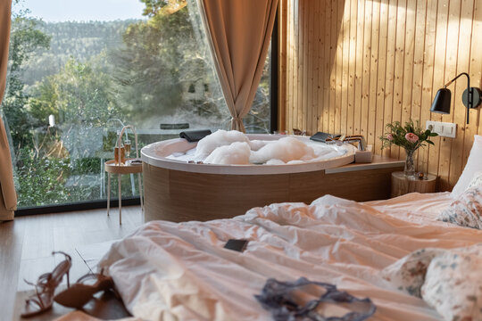 Messy rural hotel suite with jacuzzi