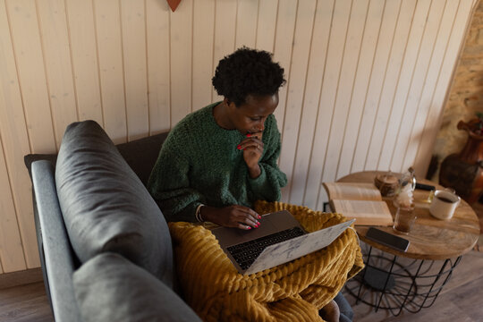 Focused woman working on laptop