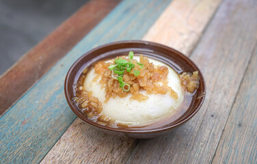 Steamed Rice Cake, with savory topping. Asian cuisine.