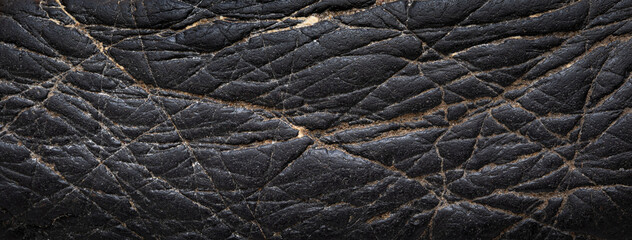 Black stone texture background. Close up of a stone. close up of a pile of black stone. close up of a black and white background of the sea salt