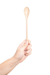 Female hand holding a brown plastic spoon isolated on white background.