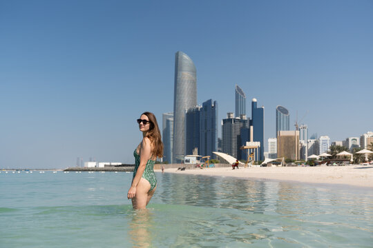 Woman enjoying time in the water in Abu Dhabi beach