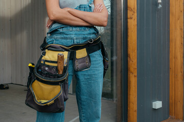 Woman builder prepares for construction repairs in progress