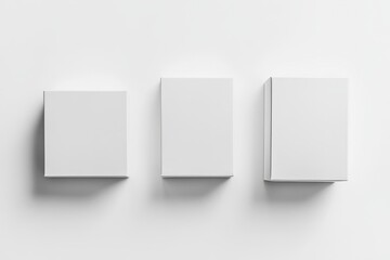 Fototapeta premium Minimalist display of three blank white boxes on light background