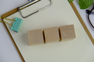 Wooden block, alarm clock with no word as a template for text space concept. business concept