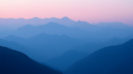 Fototapeta premium A stunning mountain landscape at dusk, with layers fading into mist and a gradient sky of pink to blue, evoking feelings of awe and the beauty of nature at twilight.