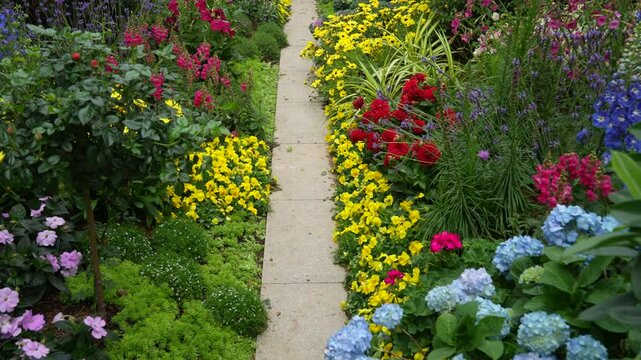 rock path leading through a flower garden
