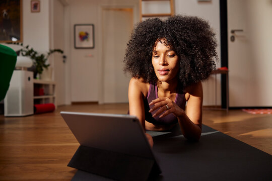 Woman working out with tutorial