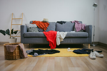 Portrait Of Lot Of Clothes And Stuffs Mess The Room