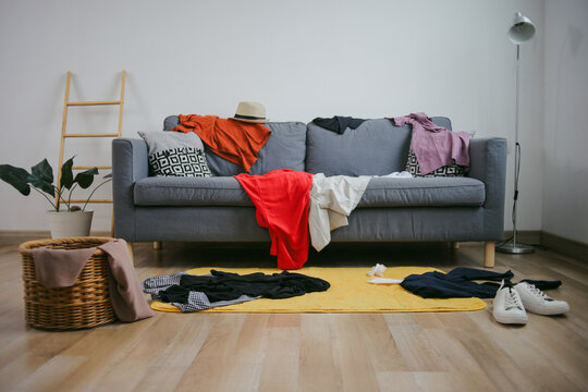 Portrait Of Lot Of Clothes And Stuffs Mess The Room