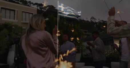 Waving Greek flag, people celebrating outdoors with sparklers and animation elements - Powered by Adobe