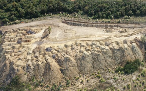 trucks dumping excavation on vacant land