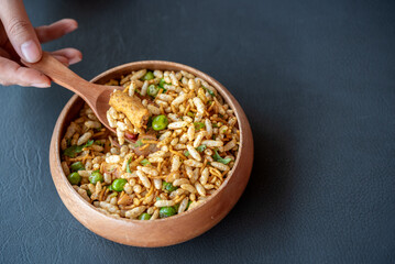 A bowl of rice with a spoon in it