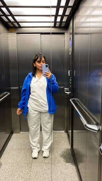 Nurse taking a selfie in elevator