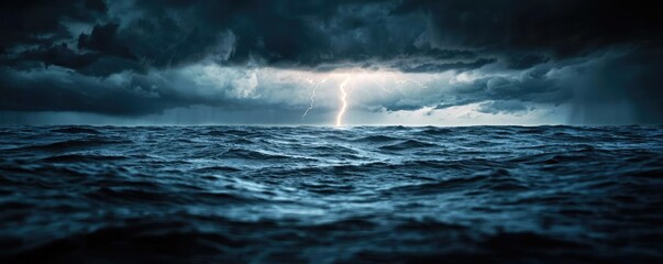 Fototapeta premium Dark sky concept. Dramatic ocean scene with dark clouds and lightning illuminating the turbulent waters.