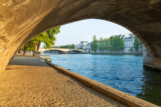 The Seine viewed from under a stone bridge. Paris.