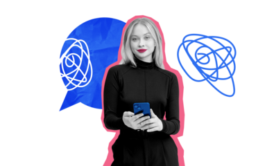 Woman inoutfit holding smartphone with abstract blue speech bubbles behind her on white background. Concept of communication and digital conversations