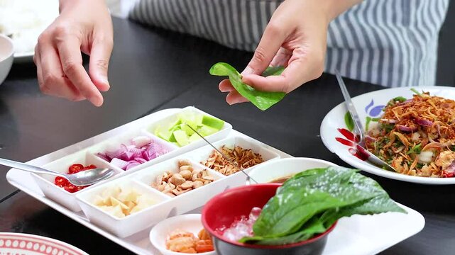 Preparing Miang Kham Savoury Leaf Wraps