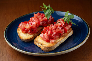 traditional bruschetta, toasted bread, tomato, garlic, olive oil and basil